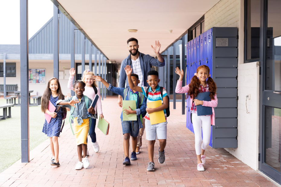 Elementary school students walking with a teacher after dismissal, representing verified and safe student release using Kidz and Keyz software in Charleston schools