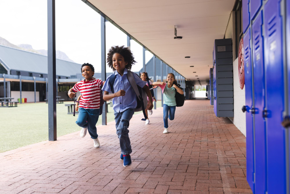 Elementary school students running on campus representing how Kidz and Keyz supports schools and empowers districts with secure dismissal in Charleston