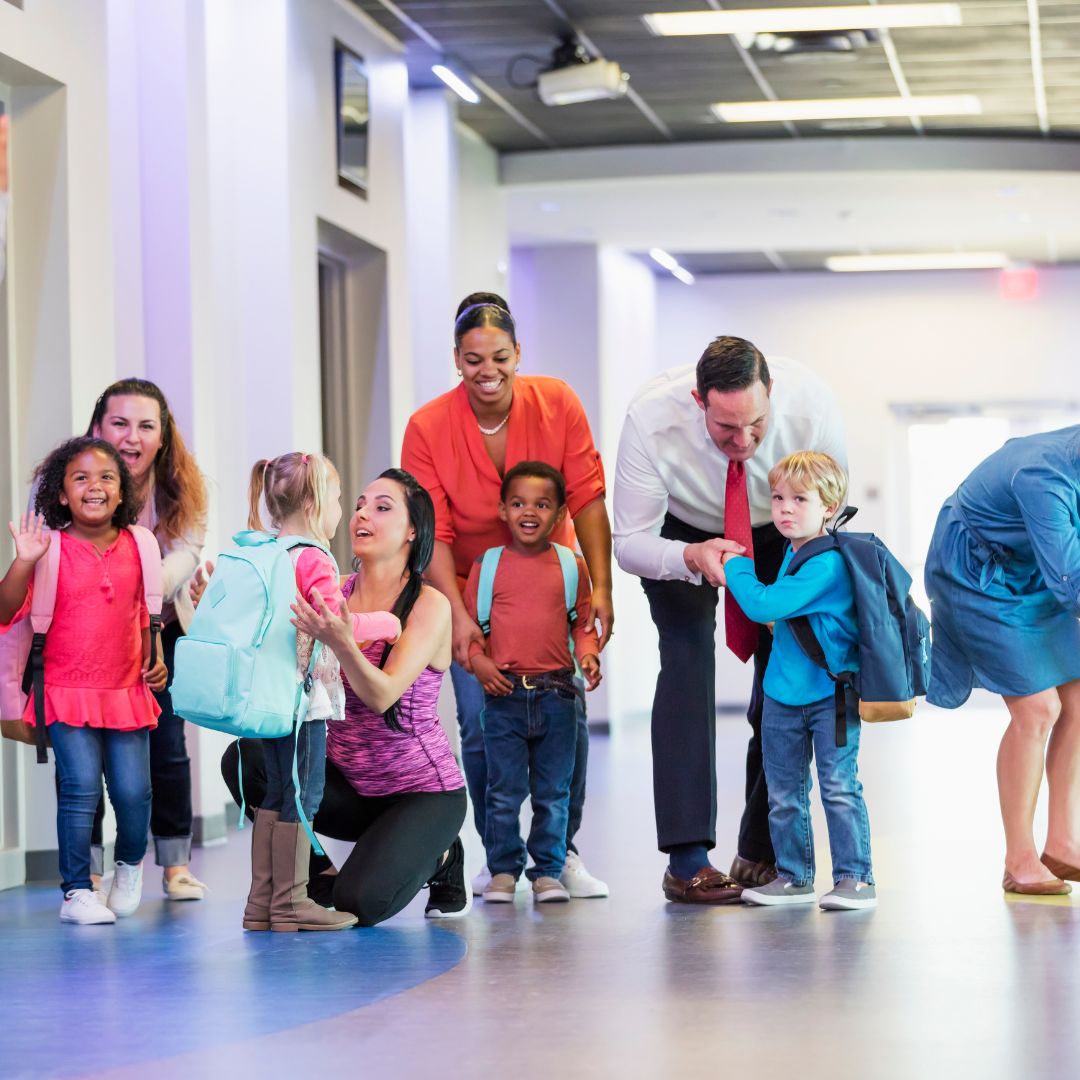 School staff and parents verifying student pickup inside a school building, showing how Kidz and Keyz prioritizes student safety during dismissal in Charleston schools