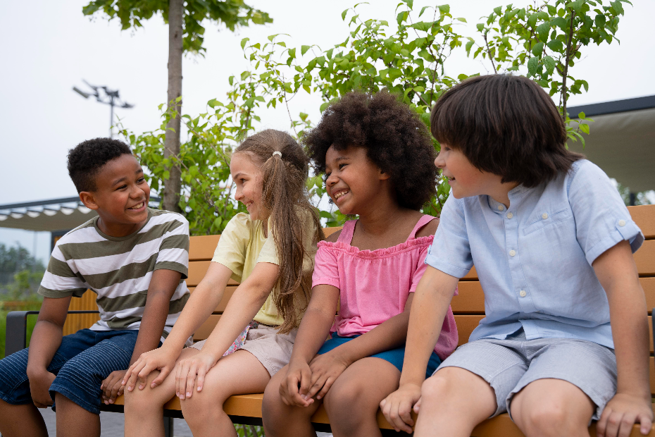 Group of elementary school children sitting together representing why Charleston schools choose Kidz and Keyz for safer and more efficient dismissal