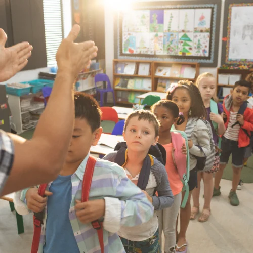 Elementary school students lined up inside a classroom representing the Kidz and Keyz mission to protect students and support safe school dismissal in Charleston